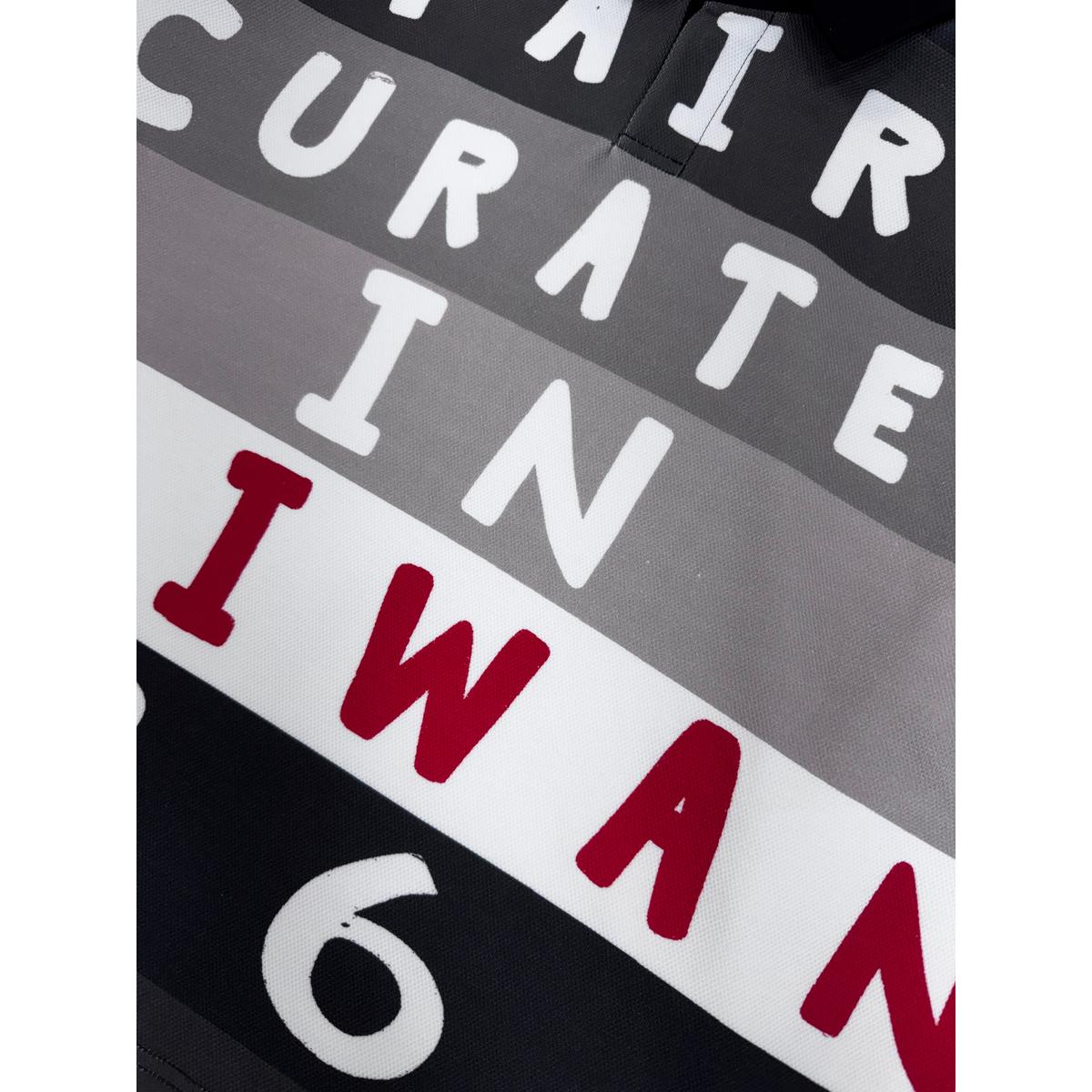 Syair Saihara Charcoal 1968 Taiwan Polo featuring graphic text design in black, grey, and red.