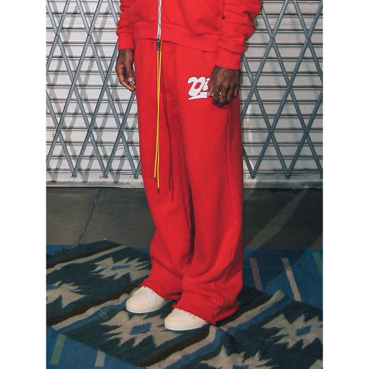 Red Diet Starts Monday wide-leg sweatpants with a white logo graphic and long contrast drawstrings.