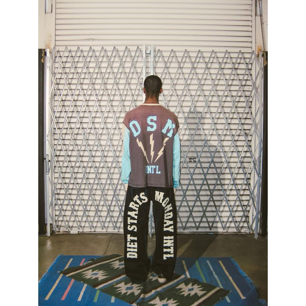 Person wearing a Diet Starts Monday | Bolt Panel Long Sleeve Tee with relaxed streetwear fit and bold graphics.