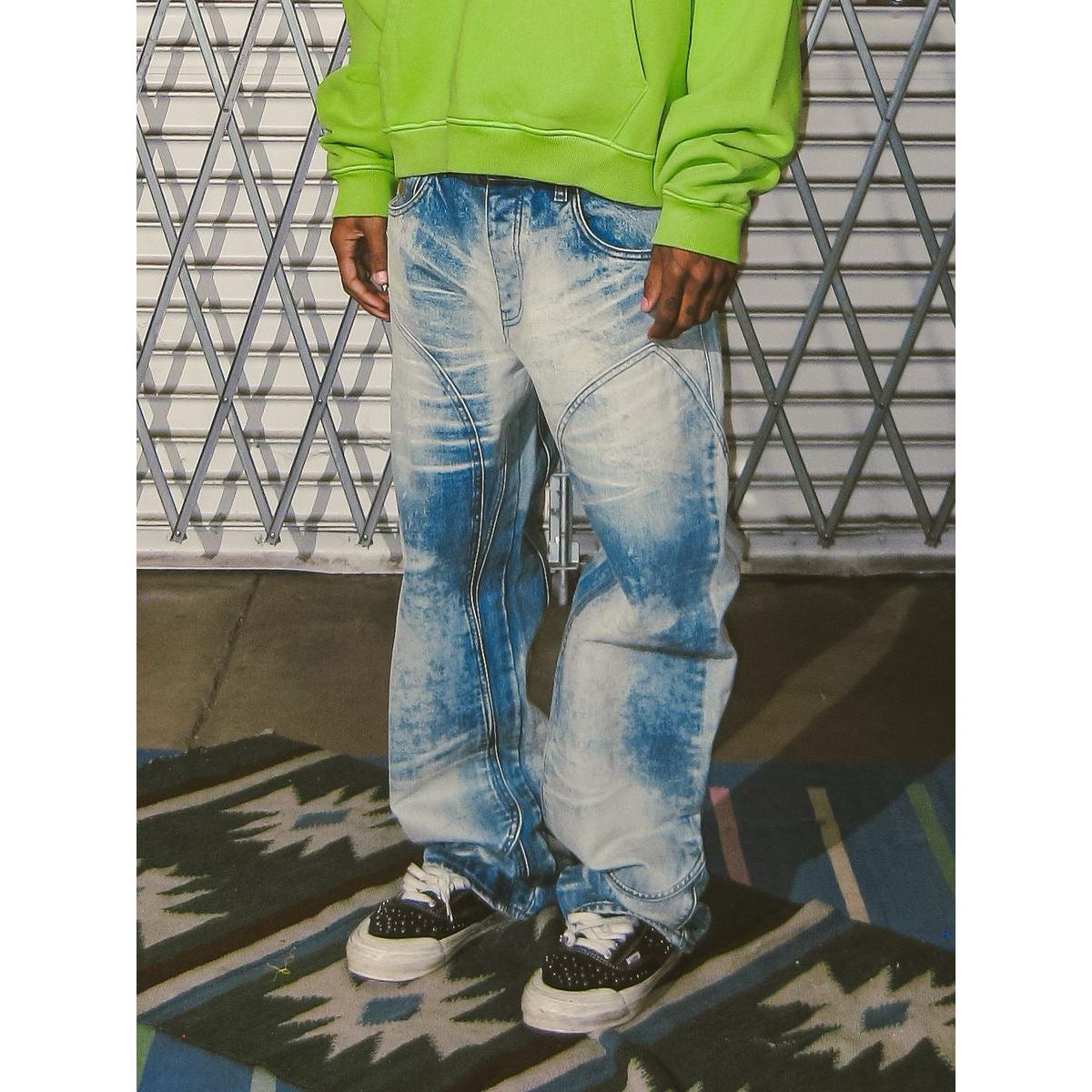 Bleach-wash baggy denim jeans with double-knee construction and bolt-inspired detailing in a relaxed, wide-leg fit.