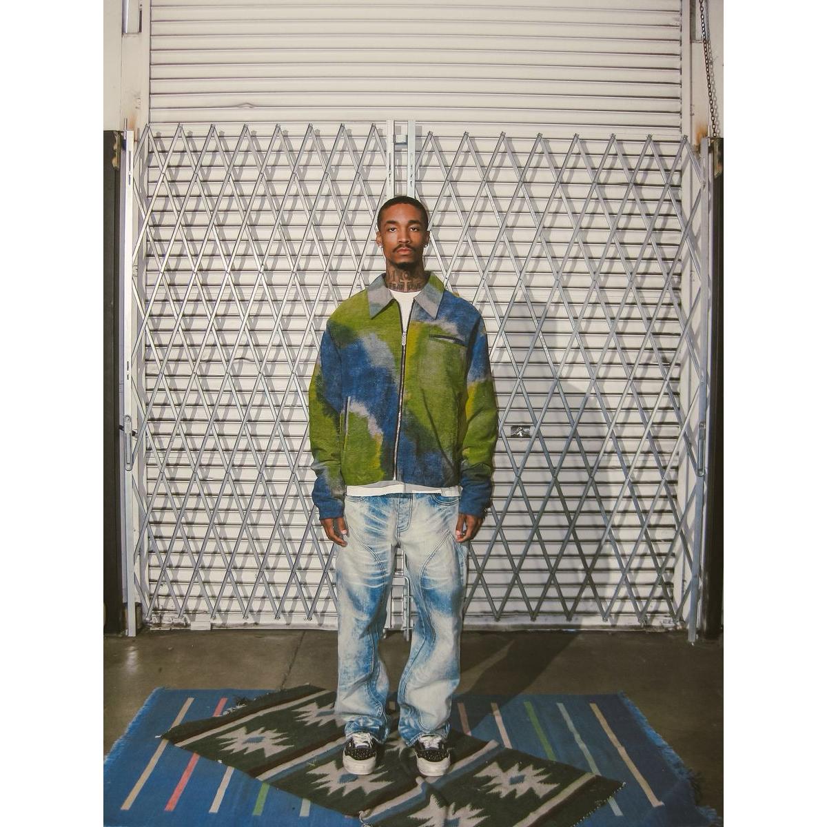 Model wearing Diet Starts Monday | Double Knee Bolt Baggy Denim - Bleach in front of a textured backdrop.