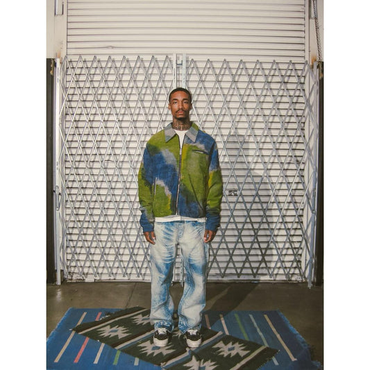 Model wearing Diet Starts Monday | Double Knee Bolt Baggy Denim - Bleach in front of a textured backdrop.