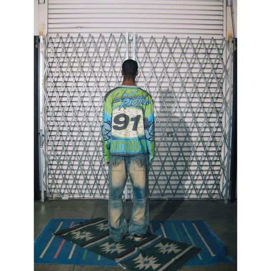 Model wearing Diet Starts Monday | MX Racing Jersey Tee showcasing bold graphics and oversized design from the back.