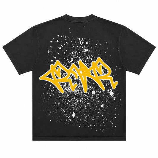 Reveer | After Hours Tee - Black featuring bold yellow graffiti on a paint-splatter design.