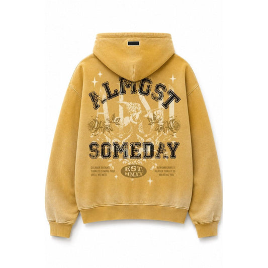 Vibrant yellow streetwear hoodie featuring a vintage-style Almost Someday graphic print on the back with a hooded silhouette.