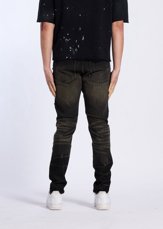 Model wearing Crysp Denim | Floral Rhinestone Skinny Jeans from the back with a black t-shirt.