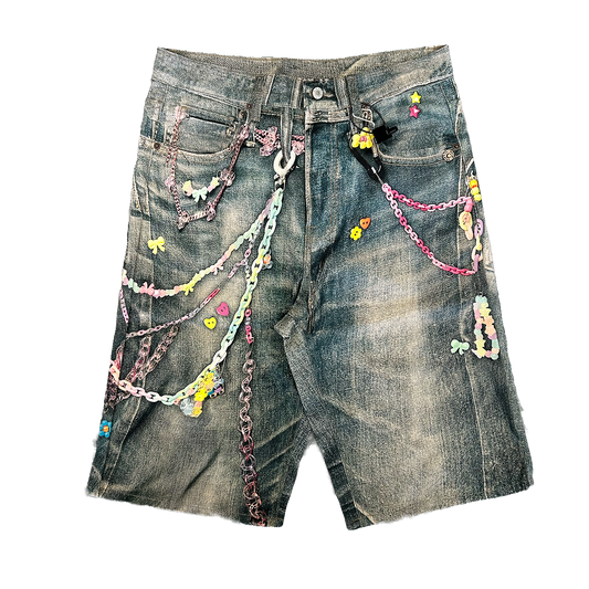vintage wash denim shorts with pastel chains and beaded charms acne studios look