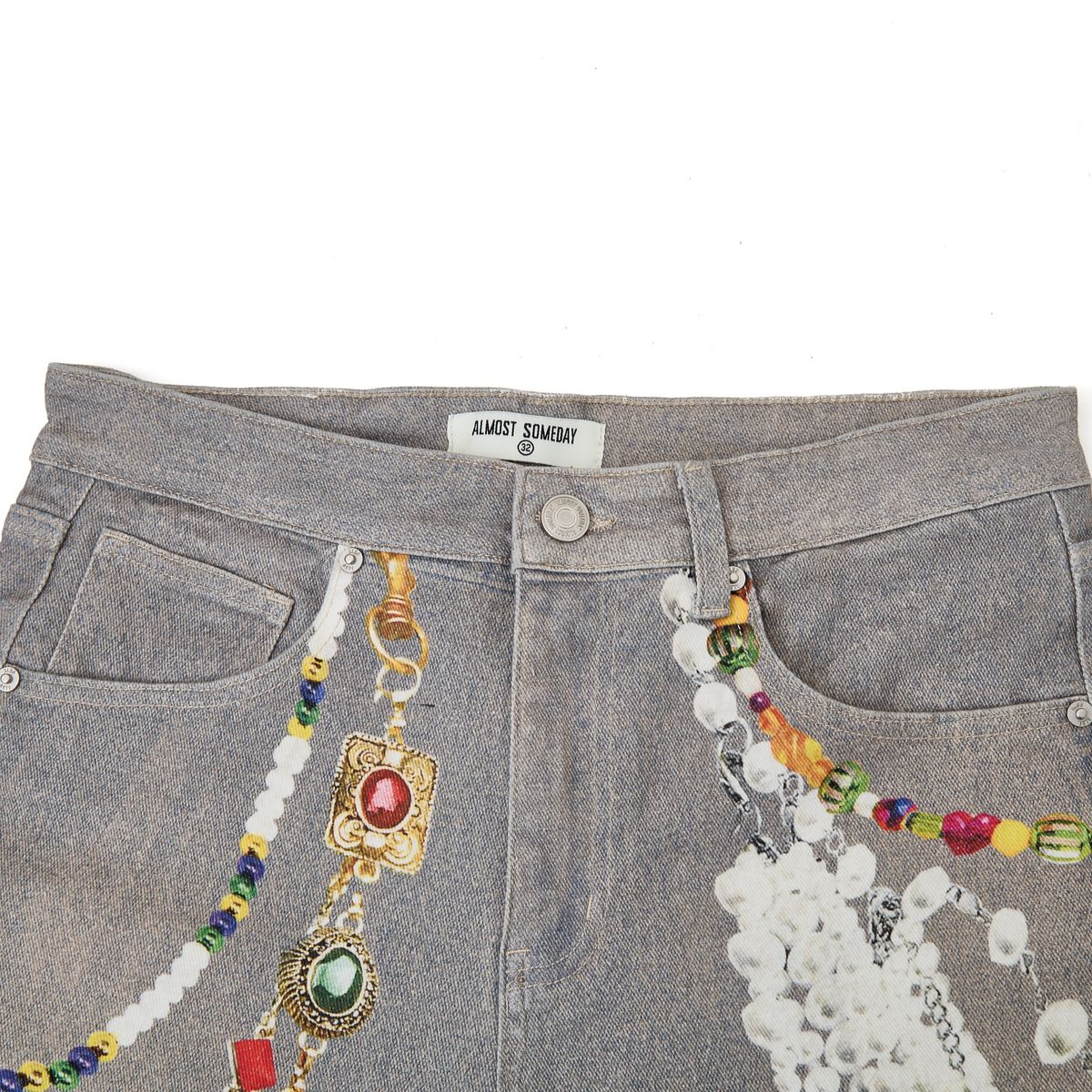printed vintage wash jeans with chain print and printed rips close up