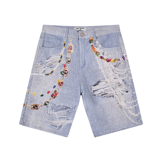 Distressed denim shorts with colorful printed embellishments on a white background