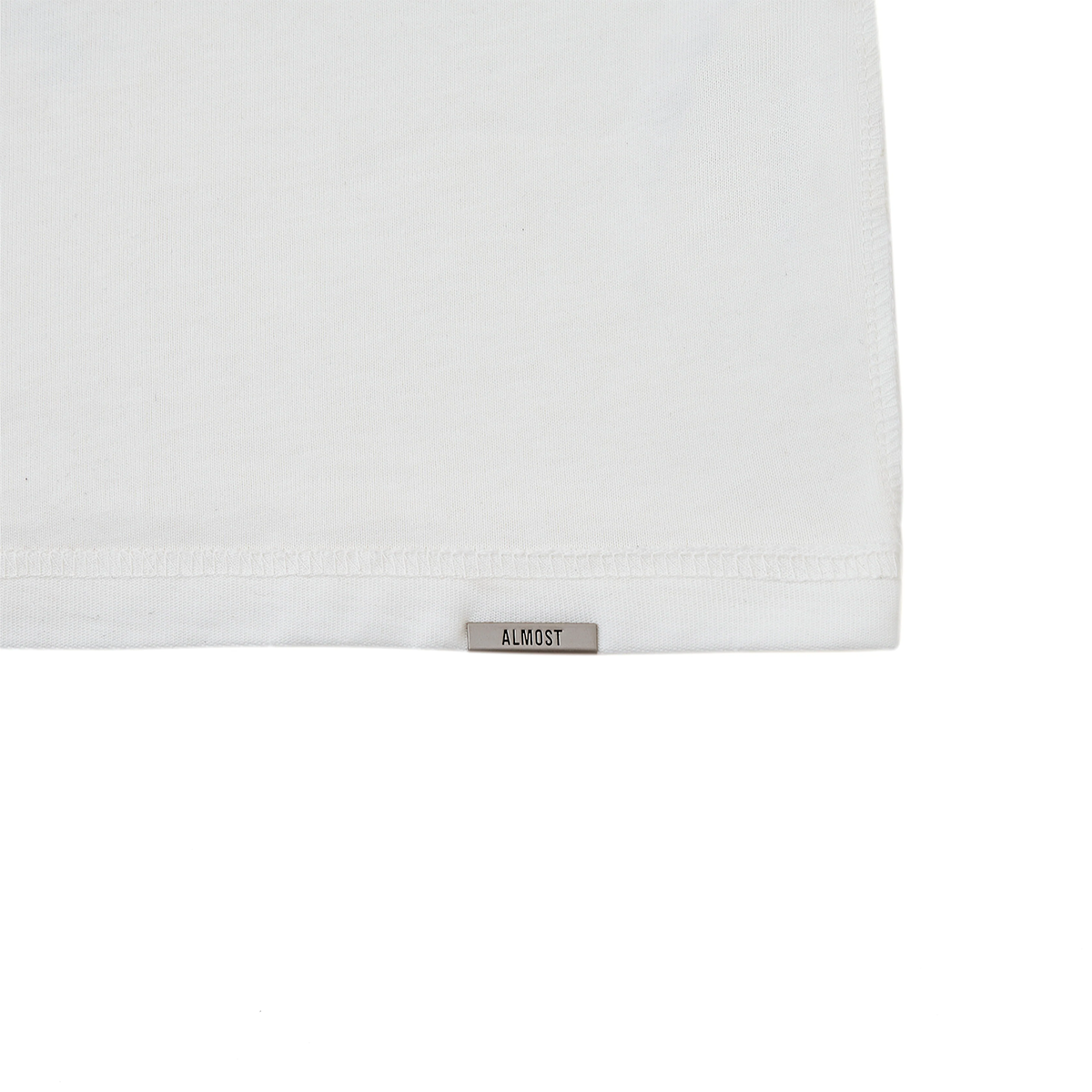 White fabric with a 'ALMOST' label on a white background