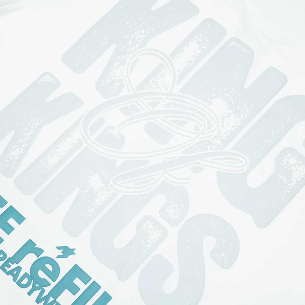 White t-shirt with text 'Kings of Kings' and 'Free Refills Ready Wear' on a white background close up