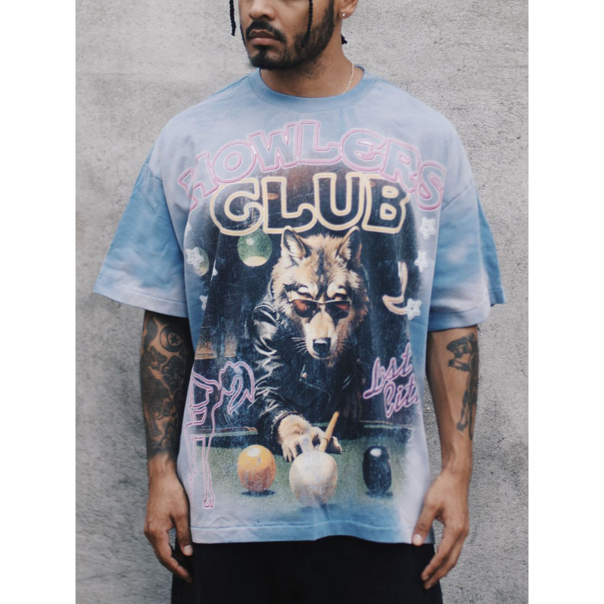 Howlers Club Last Bite Wolf graphic t-shirt front view, vintage streetwear wolf design with neon pool hall scene