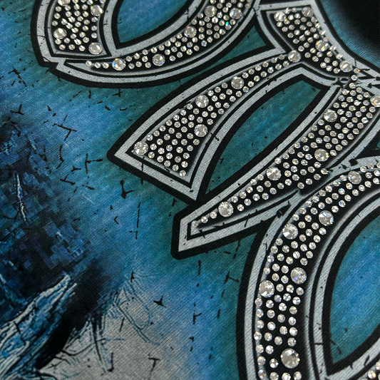 Rhinestone “Emotion” logo close-up over cracked blue artwork