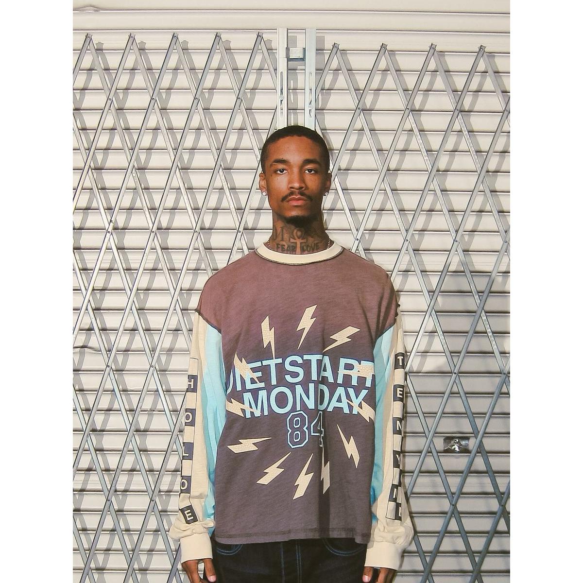 Washed brown long sleeve tee with aqua and cream contrast panels, lightning bolt graphics, and Diet Starts Monday 84 print.