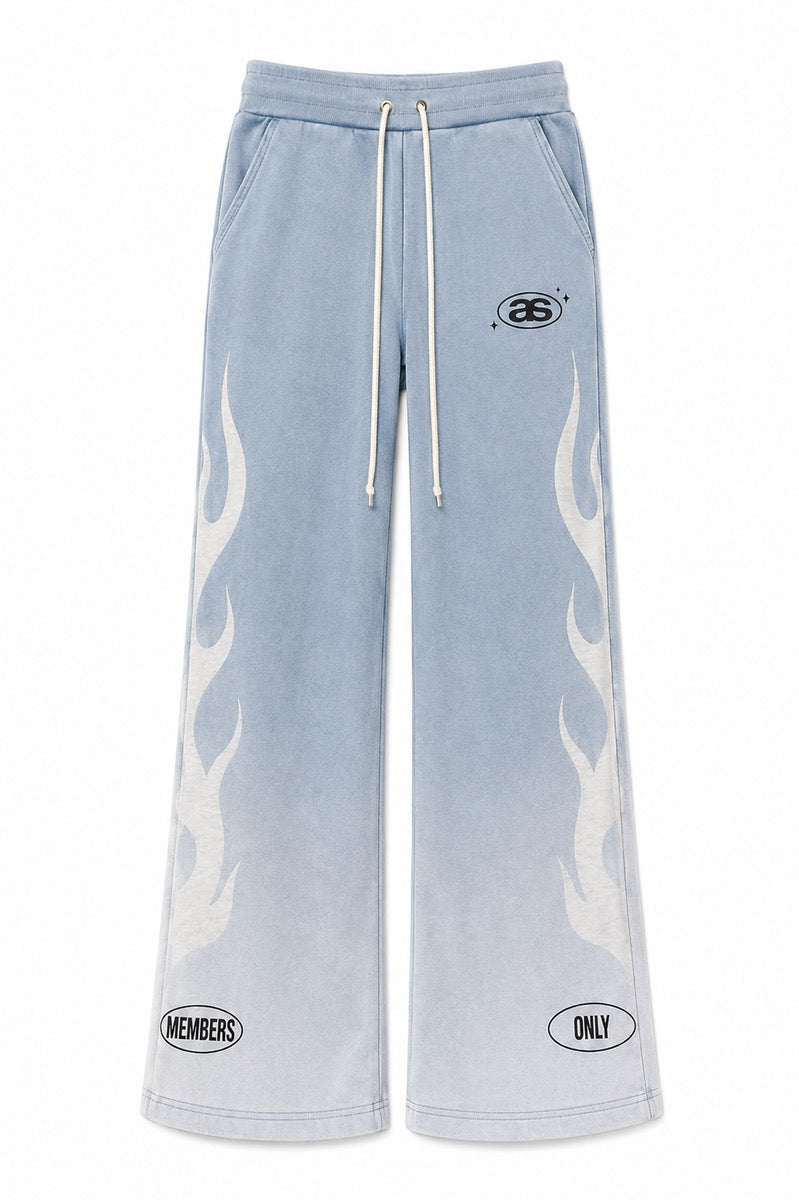 Light blue flared sweatpants with white flame graphics, drawstring waist, and Almost Someday Members branding.