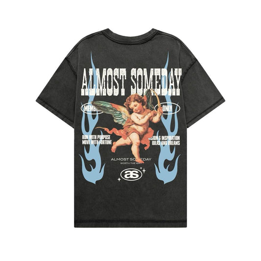 Black streetwear t-shirt featuring a vintage cherub graphic, blue flame accents, and bold Almost Someday typography.