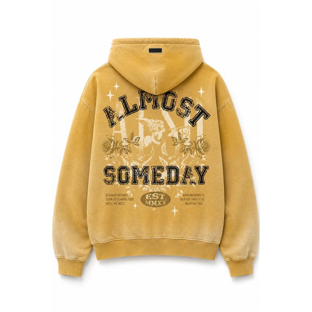 Vibrant yellow streetwear hoodie featuring a vintage-style Almost Someday graphic print on the back with a hooded silhouette.