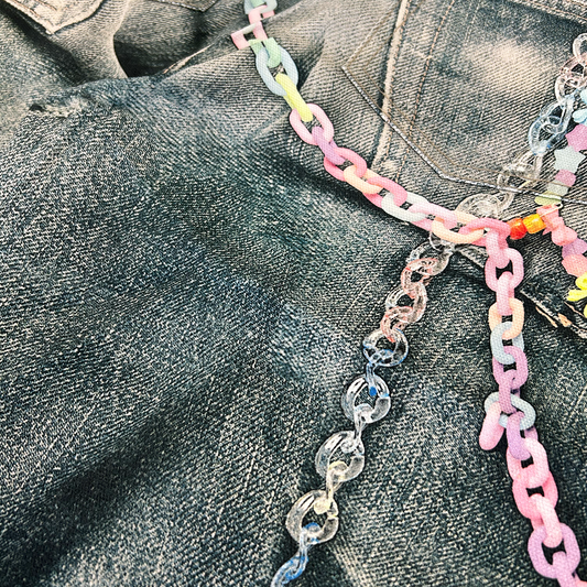 pastel chain and heart bead details on vintage wash denim shorts acne studios vibe
