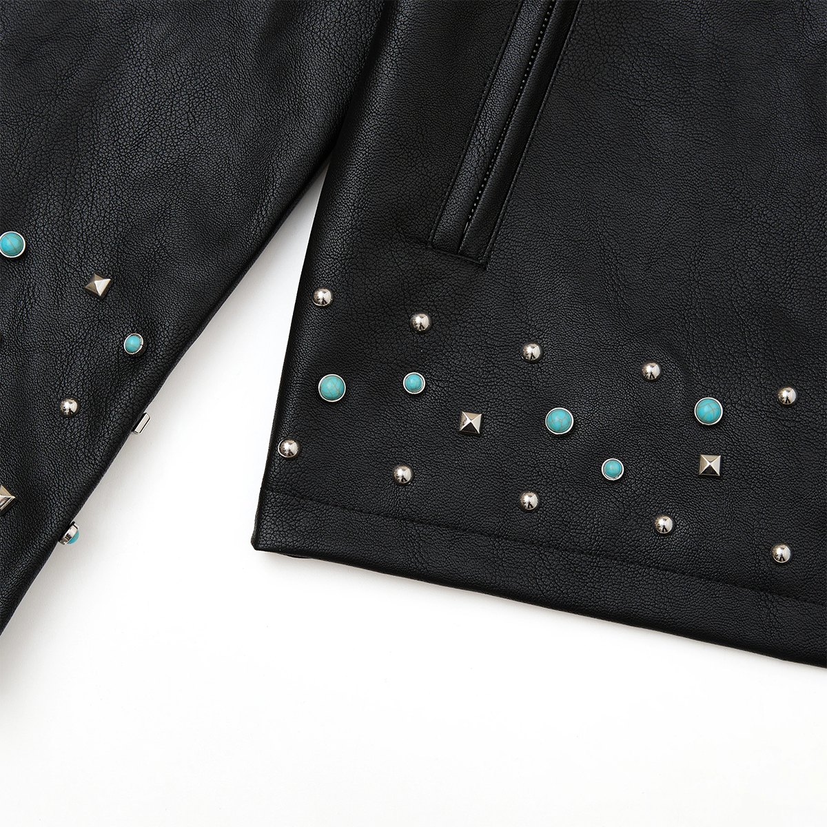 Black leather jacket with turquoise and silver studs on a white background