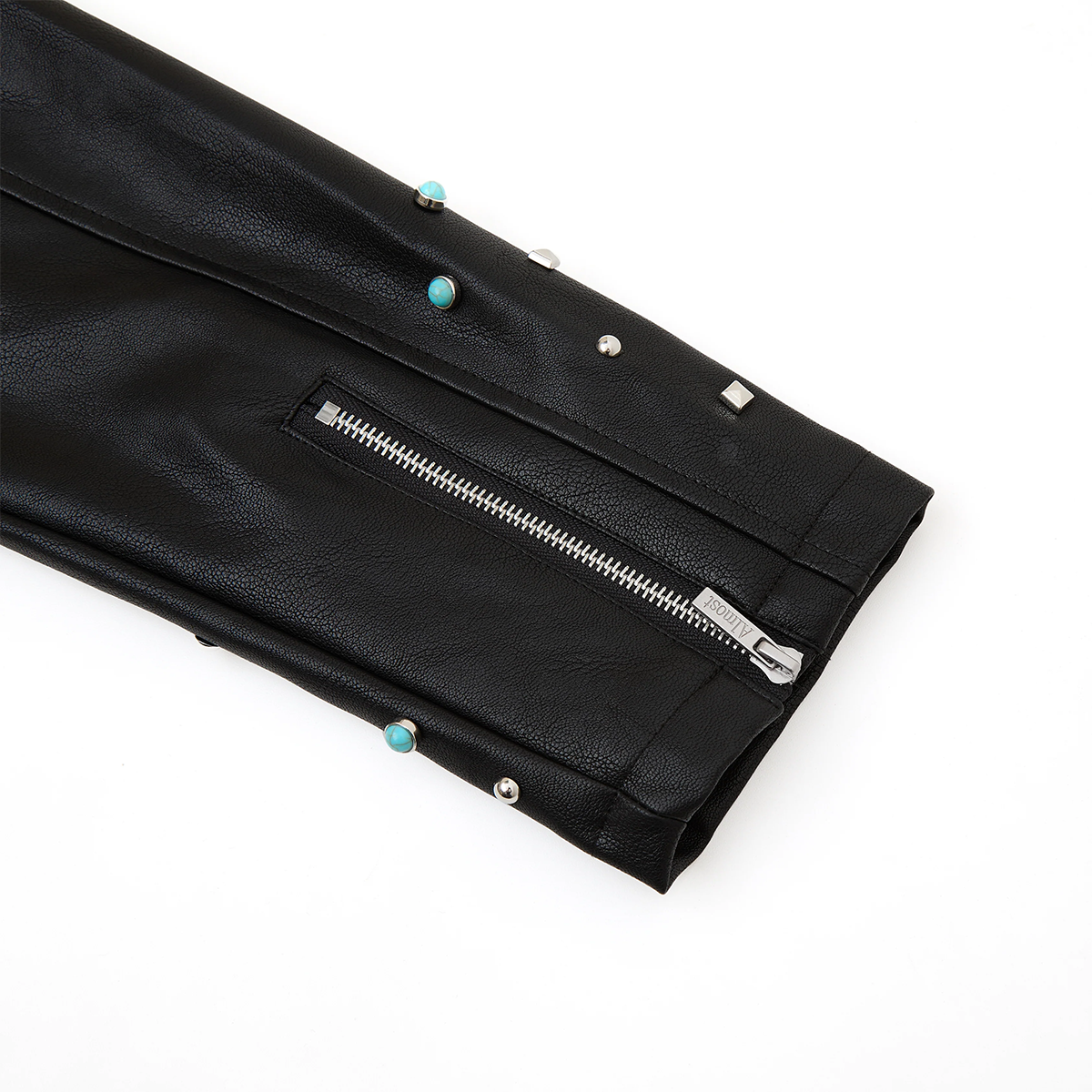 Black leather clutch with decorative studs on a white background