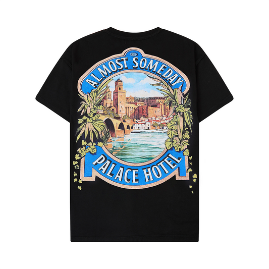 Black t-shirt with 'Almost Someday Palace Hotel' graphic design on a white background