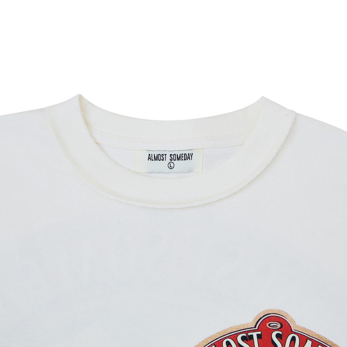 Close-up of a white shirt with 'Almost Someday' label on a white background