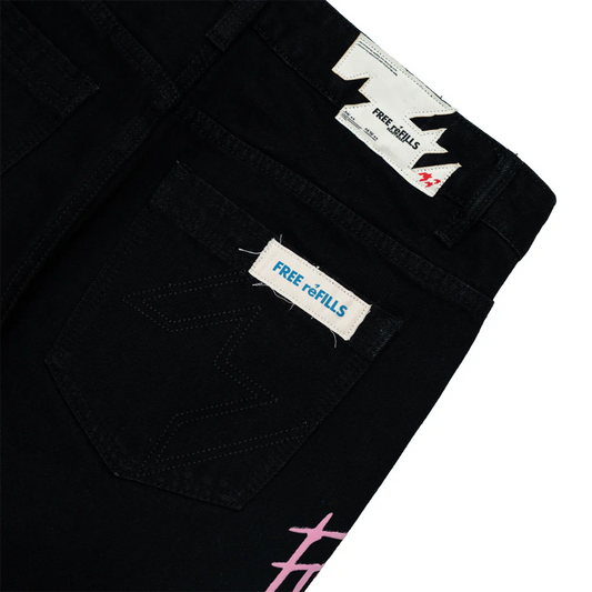 Black pants with 'Free Refills' labels on a white background