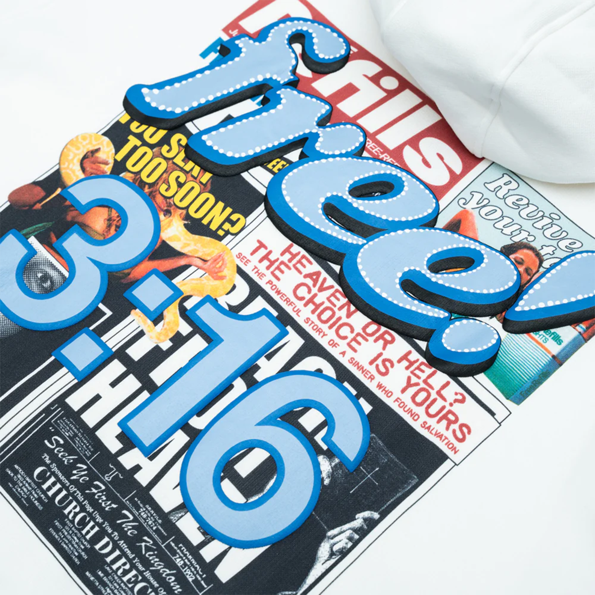 Close-up of a magazine with text and graphics, featuring large blue letters spelling 'FREE!' on a white background.