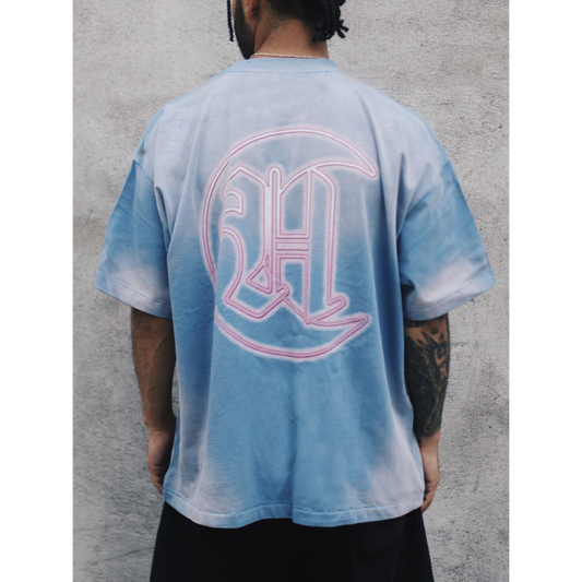 Howlers Club Last Bite Wolf graphic t-shirt back view, featuring pink neon “HC” logo on faded blue vintage wash